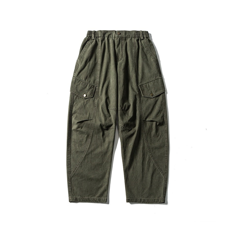 Washed green wide-leg cargo pants flat lay, front view, elastic waist, button fly and snap flap pockets