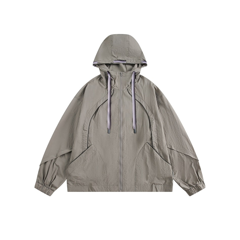 Gray hooded zip jacket with lavender drawcords, curved seam panels and large front pockets, front view