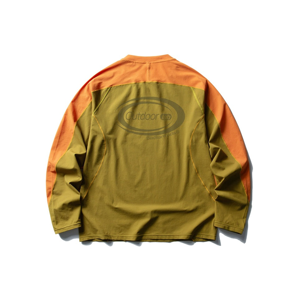 Back of an olive-green long-sleeve top with orange shoulder and sleeve panels, contrast seams, and a large back logo.