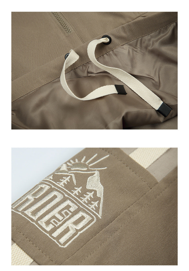 Close-ups of the taupe jacket’s cream waist drawcords and white embroidered mountain-and-sun graphic.