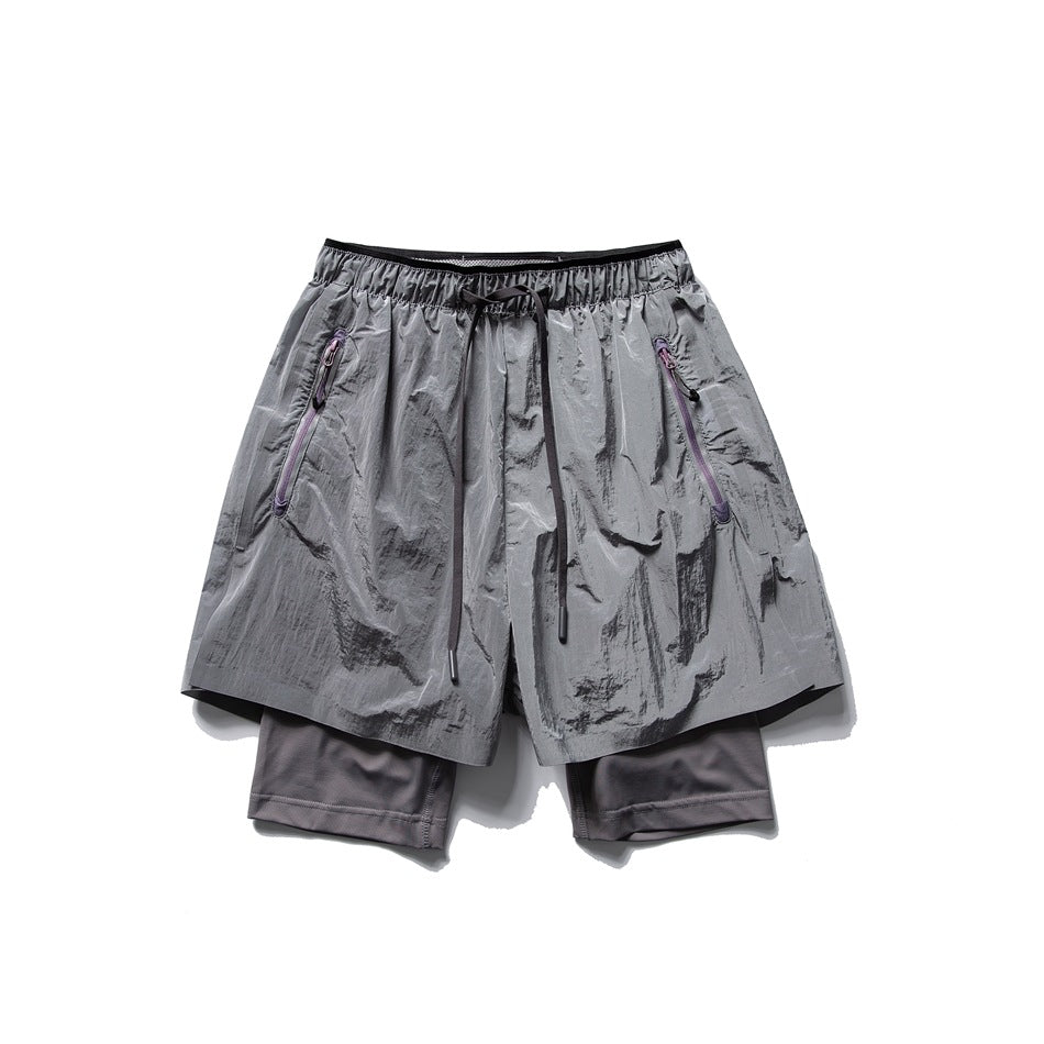 Gray double-layer athletic shorts with drawstring waist, purple zippered pockets and a darker gray inner layer