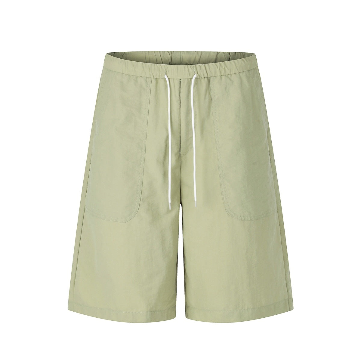 Light green knee-length shorts with elastic waist, white drawstring and large front patch pockets, front view