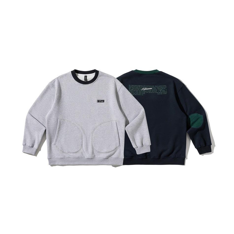 Gray sweatshirt front and navy sweatshirt back, both with rounded lower pockets; the navy back has green elbow patches and