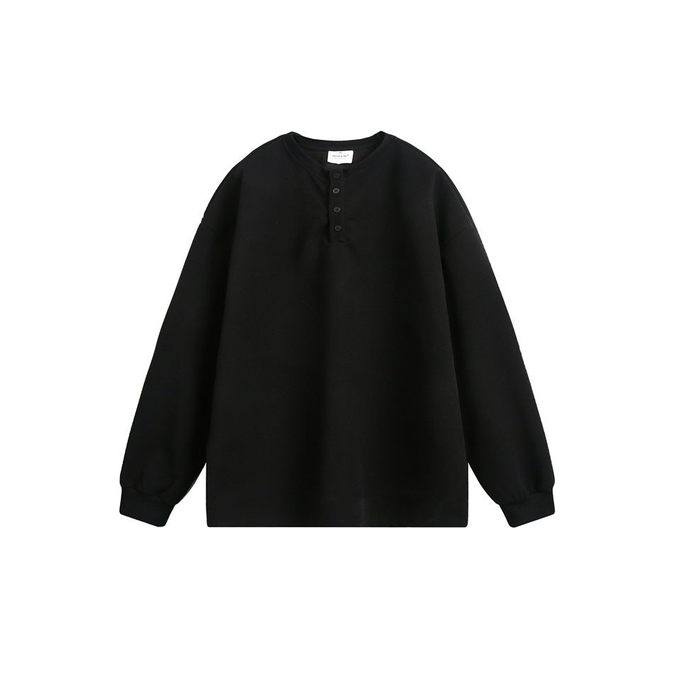 Black long-sleeve Henley pullover with round neck, four buttons and ribbed cuffs, flat lay on white background