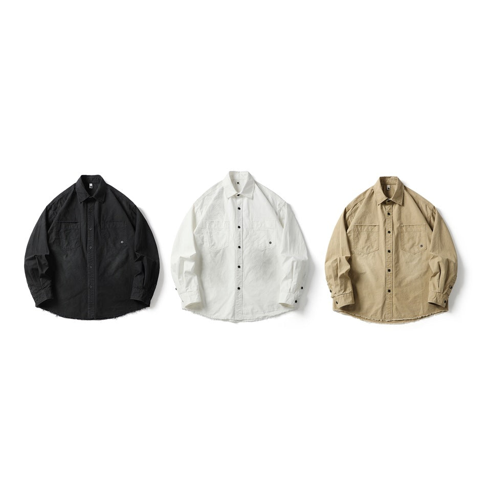 Three long-sleeve button-up shirts shown from the front in black, white, and tan.