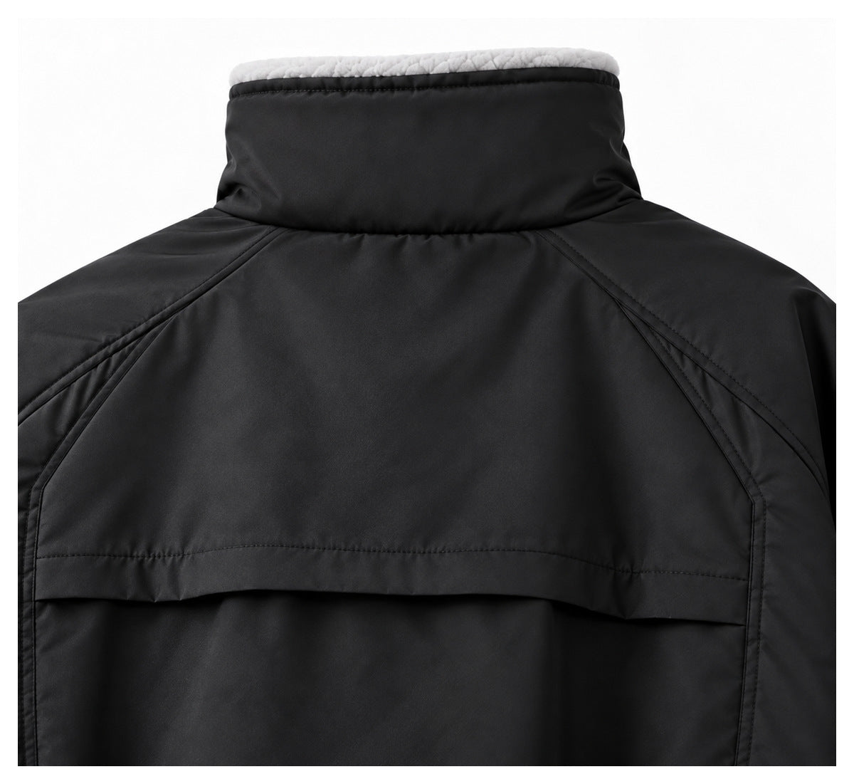Close-up of a black jacket's back yoke and tall collar, with pale fleece lining visible at the collar edge.