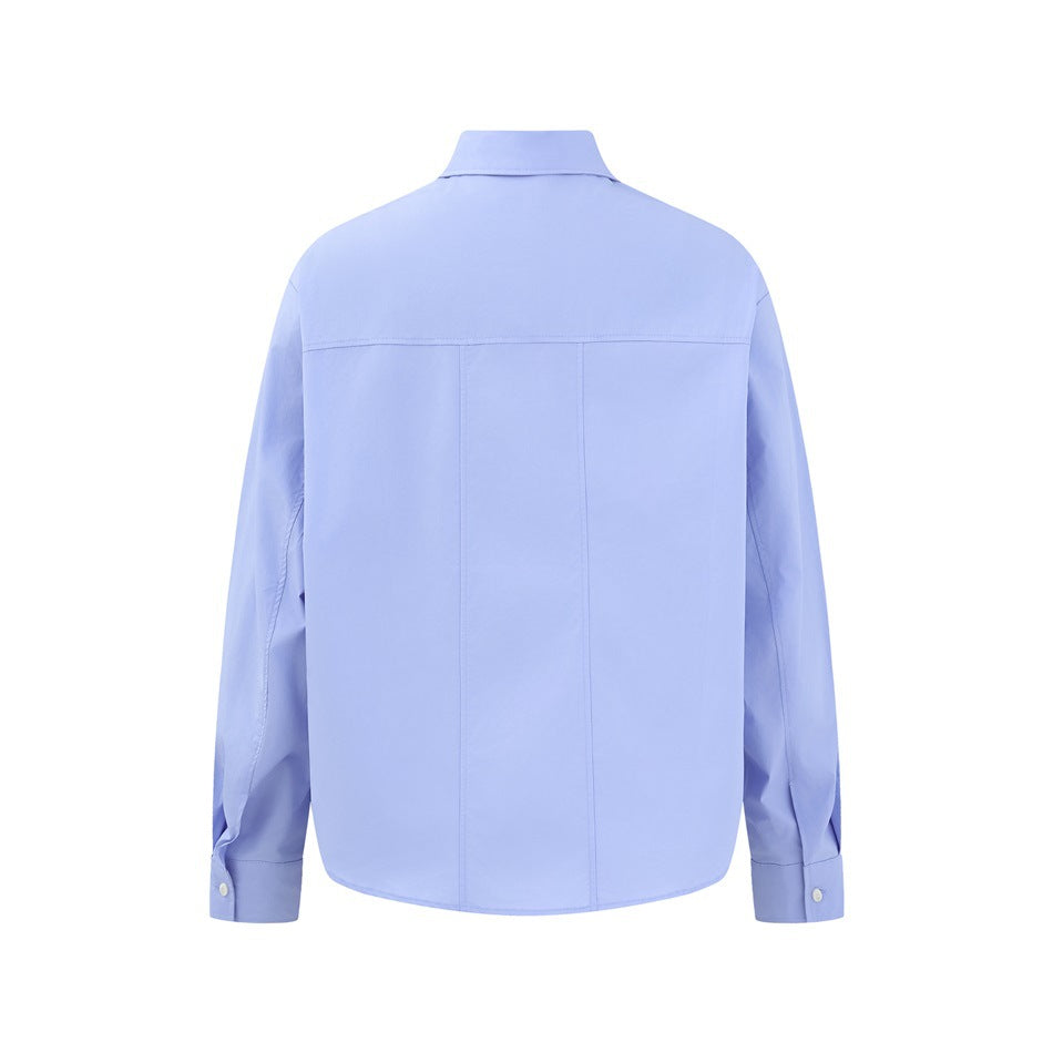 Back view of a light blue long-sleeve shirt with a yoke seam and vertical back seams.