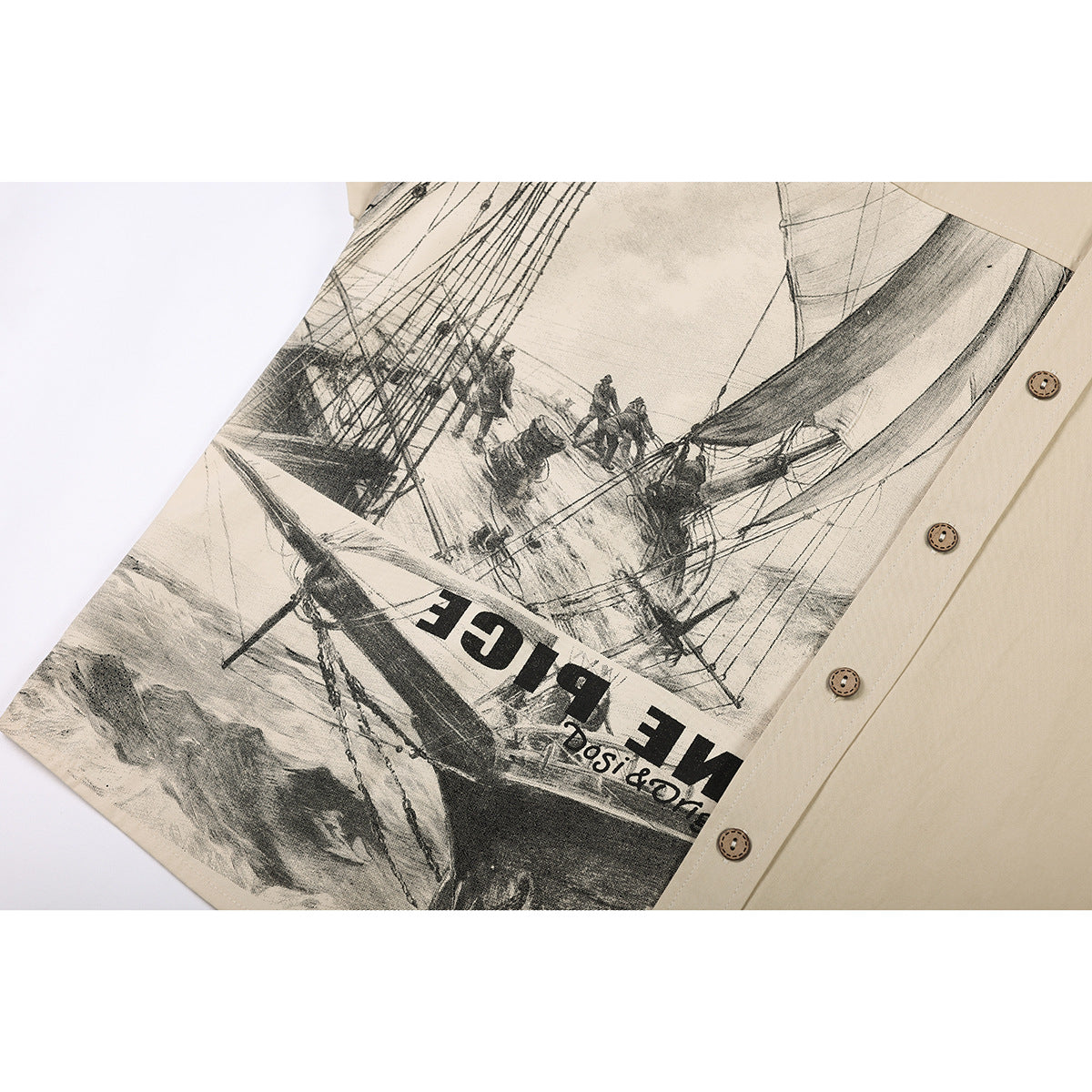 Close-up of a beige shirt with a large monochrome sailing ship graphic and partial lettering.