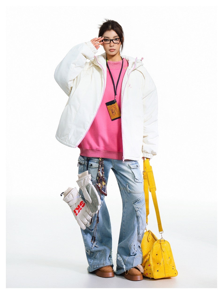 Full-length model wearing an open white hooded jacket with pink zipper trim and a bright pink top.