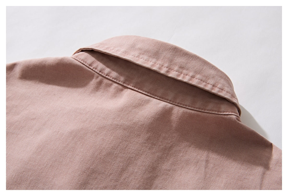Close-up of the dusty rose shirt's back collar and upper back stitching.