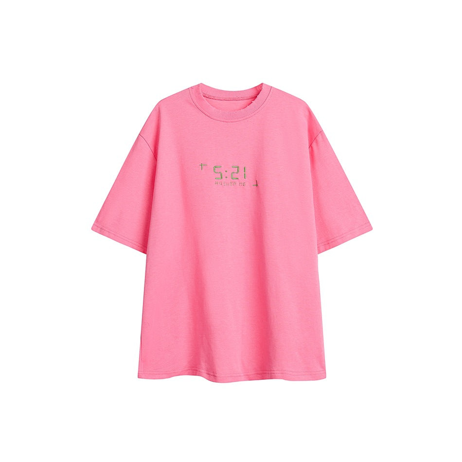 Pink short-sleeve crew-neck T-shirt with green embroidered 5:21 digital-style graphic on the chest
