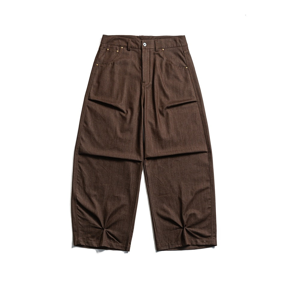 Brown wide-leg pants with pinched hem pleats, front flat lay view