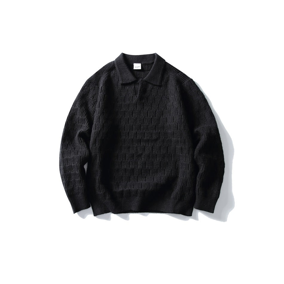 Black textured knit polo-collar sweater with V placket and ribbed cuffs, laid flat, front view