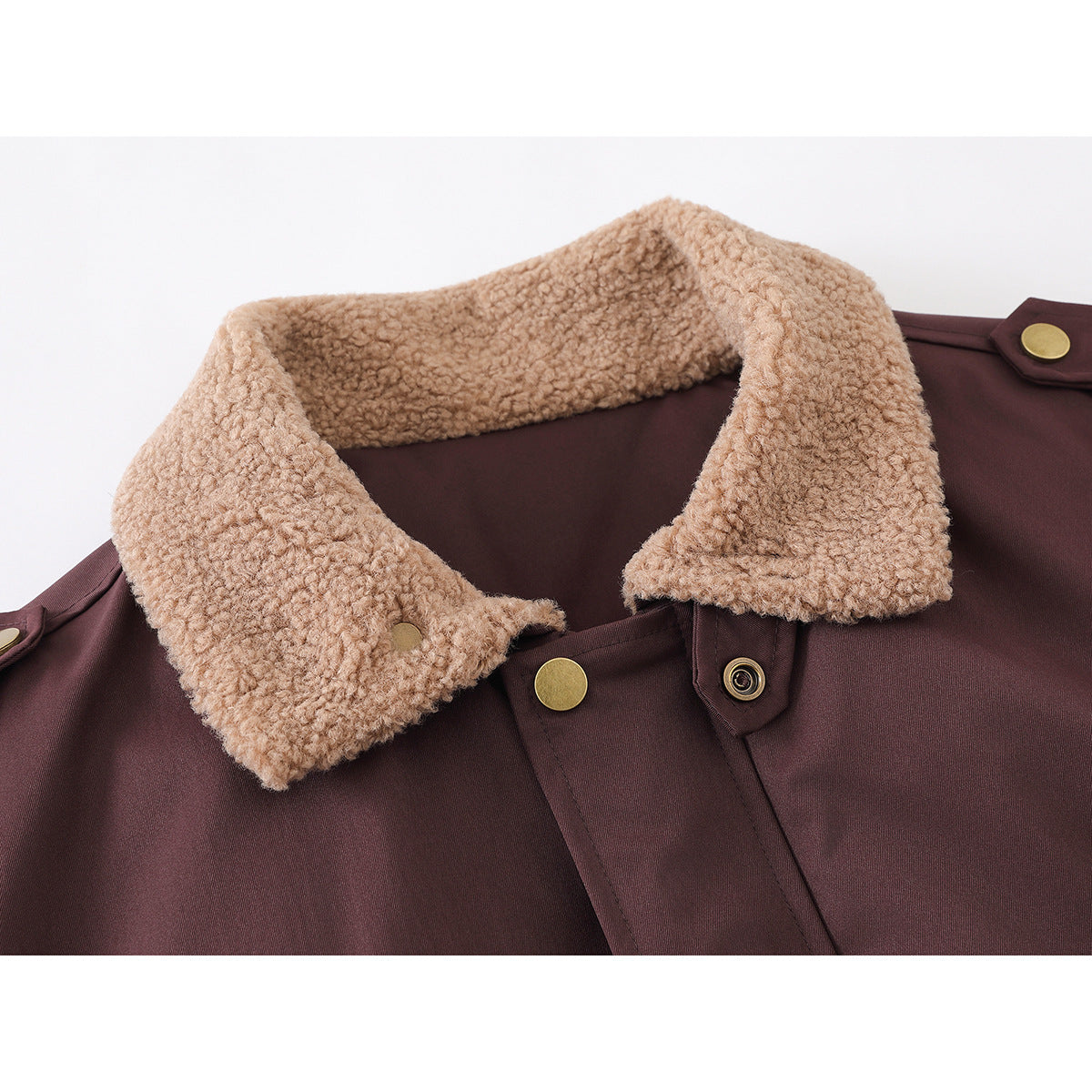 Close-up of a burgundy jacket with a textured tan collar and brass-tone snaps.