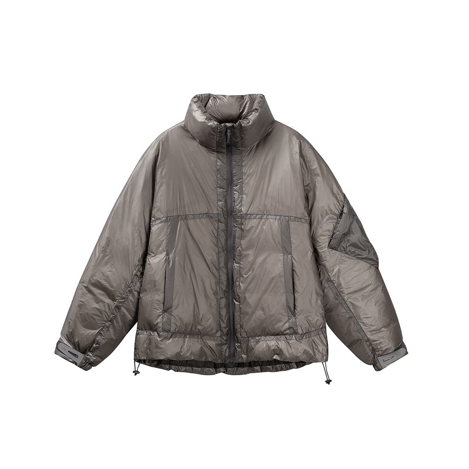 Gray glossy quilted stand-collar puffer jacket with front zipper, taped pockets and drawcord hem, flat front view
