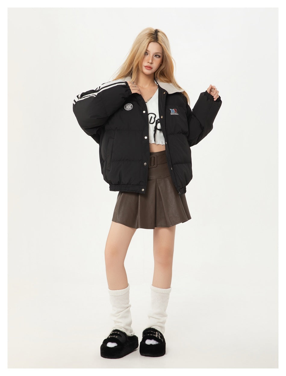 Model wearing a black padded jacket with white sleeve stripes and a light collar, shown from the front.