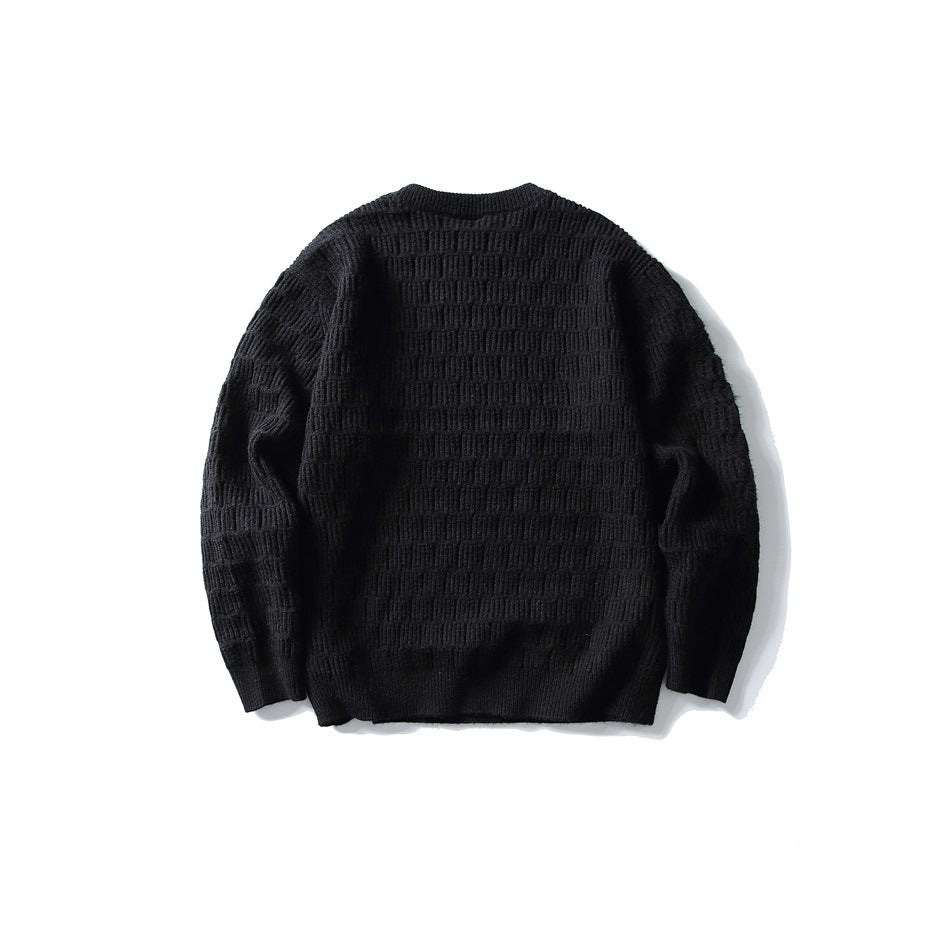 Black crew-neck knit sweater with basket-weave texture, flat lay back view