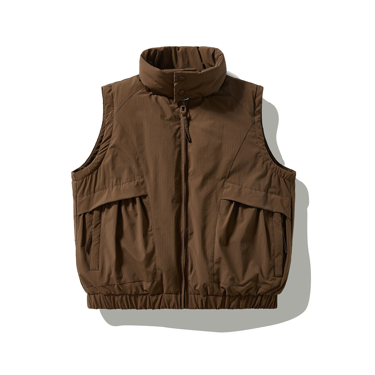 Coffee brown sleeveless padded vest with stand collar, front zip, flap pockets and elastic hem, flat lay