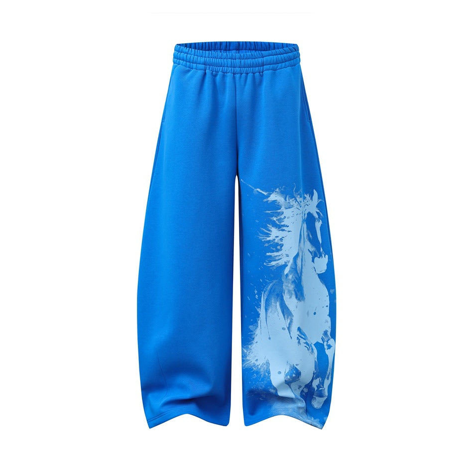Bright blue wide-leg sweatpants with elastic waist and light blue running horse print on the lower leg