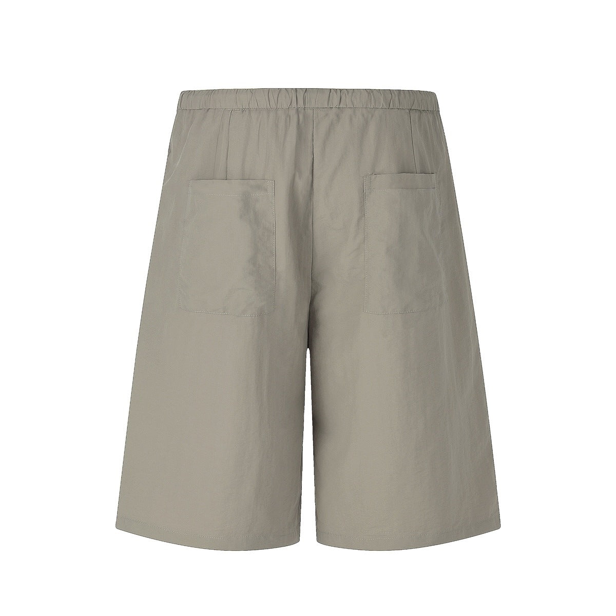 Back view of taupe-gray, wide-leg shorts with an elastic waistband and two patch pockets.