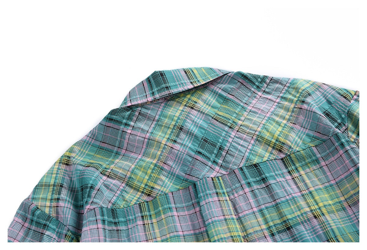 Close view of the back yoke and collar of a teal multicolor plaid shirt.