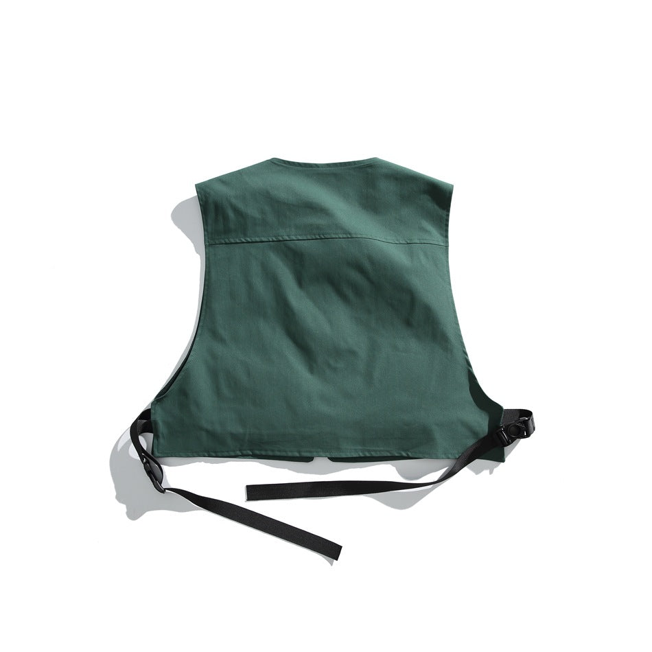 Back of a dark green sleeveless vest with black adjustable side straps, laid flat on a white background.