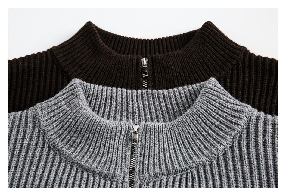 Close-up of gray and dark brown rib-knit cardigan collars and front zippers.