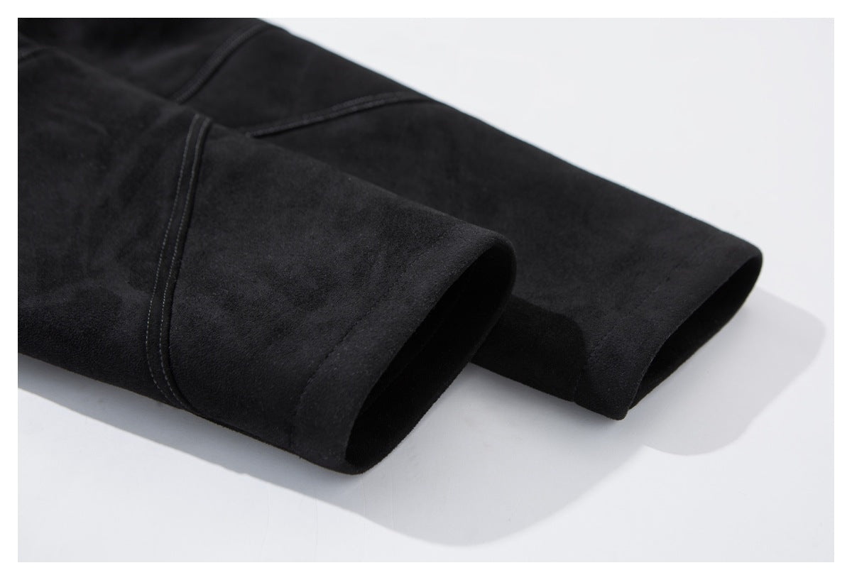 Close-up of a black jacket sleeve cuff with visible seam stitching.