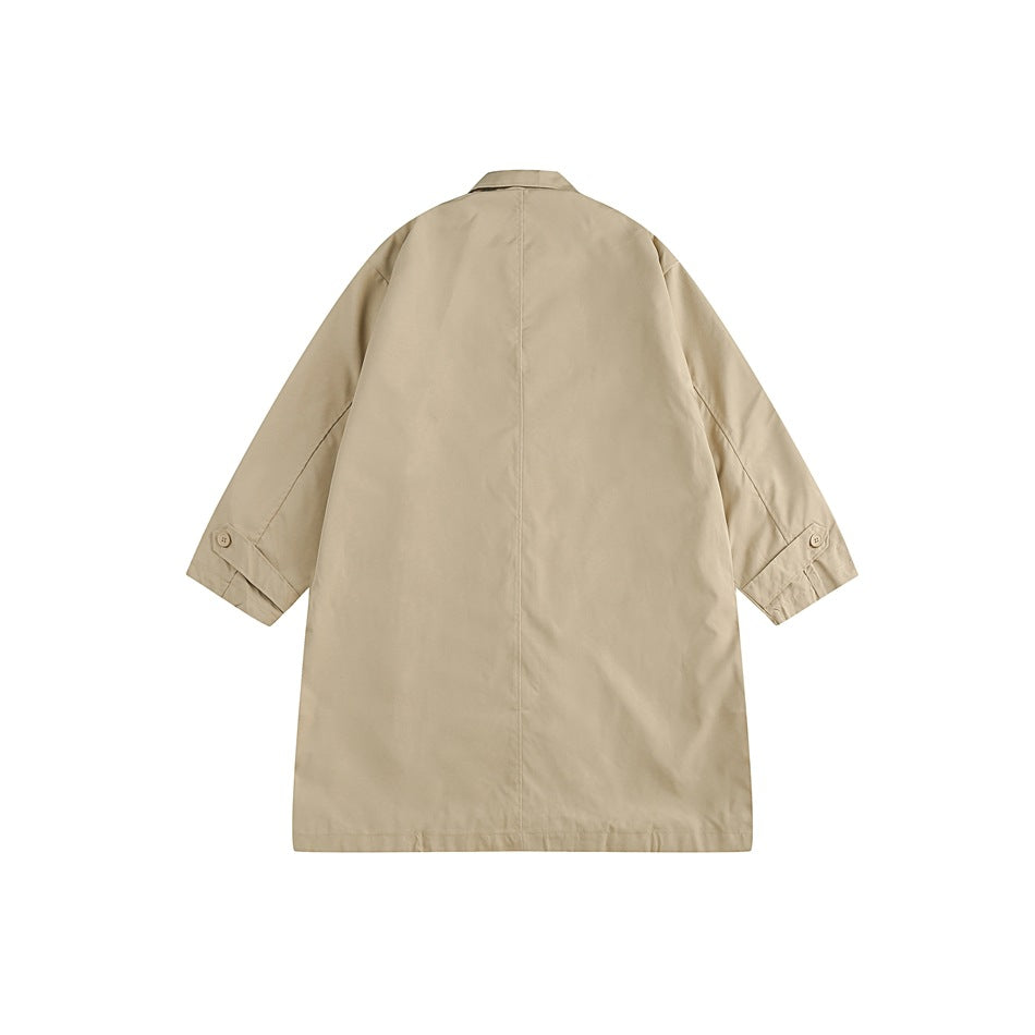 Back view of a light beige long coat with a center seam, pointed collar, and buttoned cuff tabs.