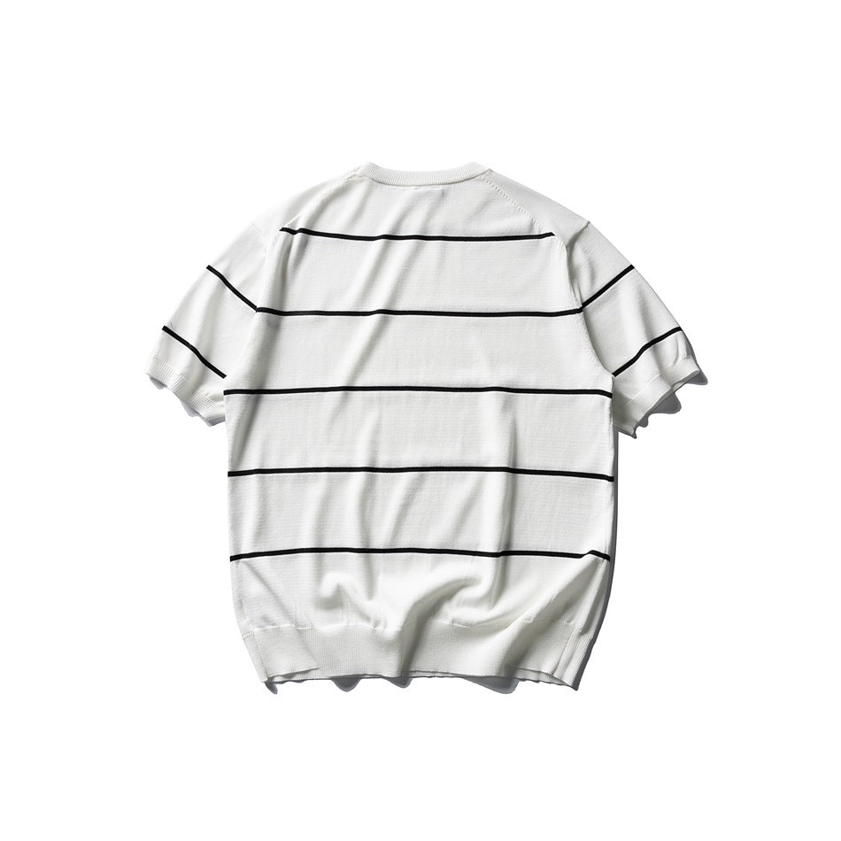 Back view of an ivory short-sleeve knit top with black horizontal stripes, a crew neck, and ribbed hem.