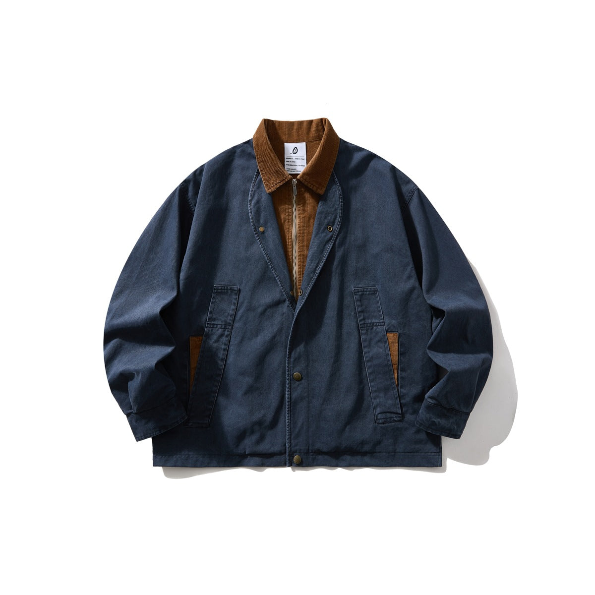 Front view of a navy jacket with a brown corduroy collar and inner panel, snap buttons, and two front pockets.
