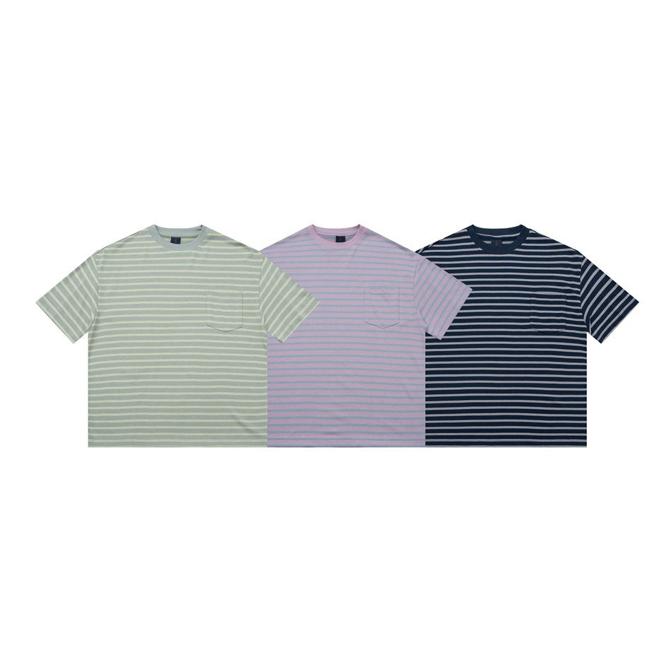 Front views of three short-sleeve striped crew-neck T-shirts in sage green, pink, and navy, each with a chest pocket.