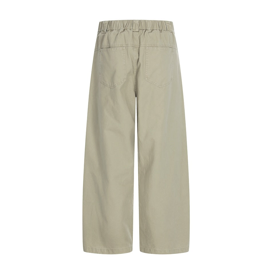 Back view of light khaki wide-leg pants with an elastic waistband and two rear patch pockets, shown on a white background.