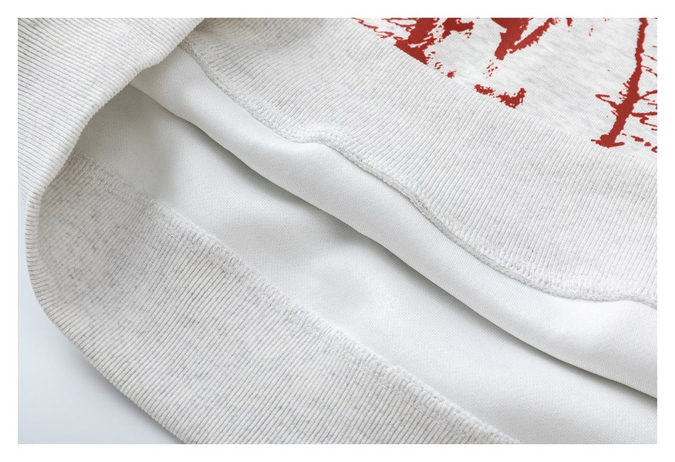 Close-up of the sweatshirt’s ribbed bottom hem and interior stitching.