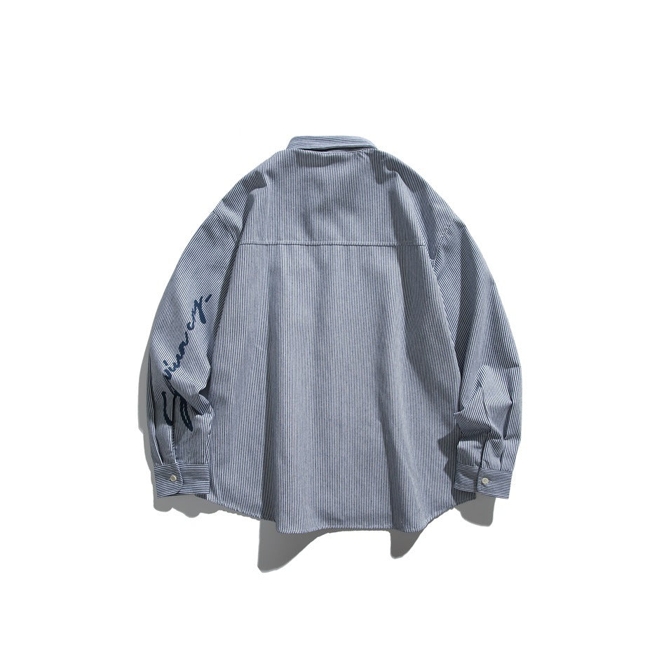 Back view of a dark blue and white pinstriped button-up shirt with a sleeve graphic and button cuffs.
