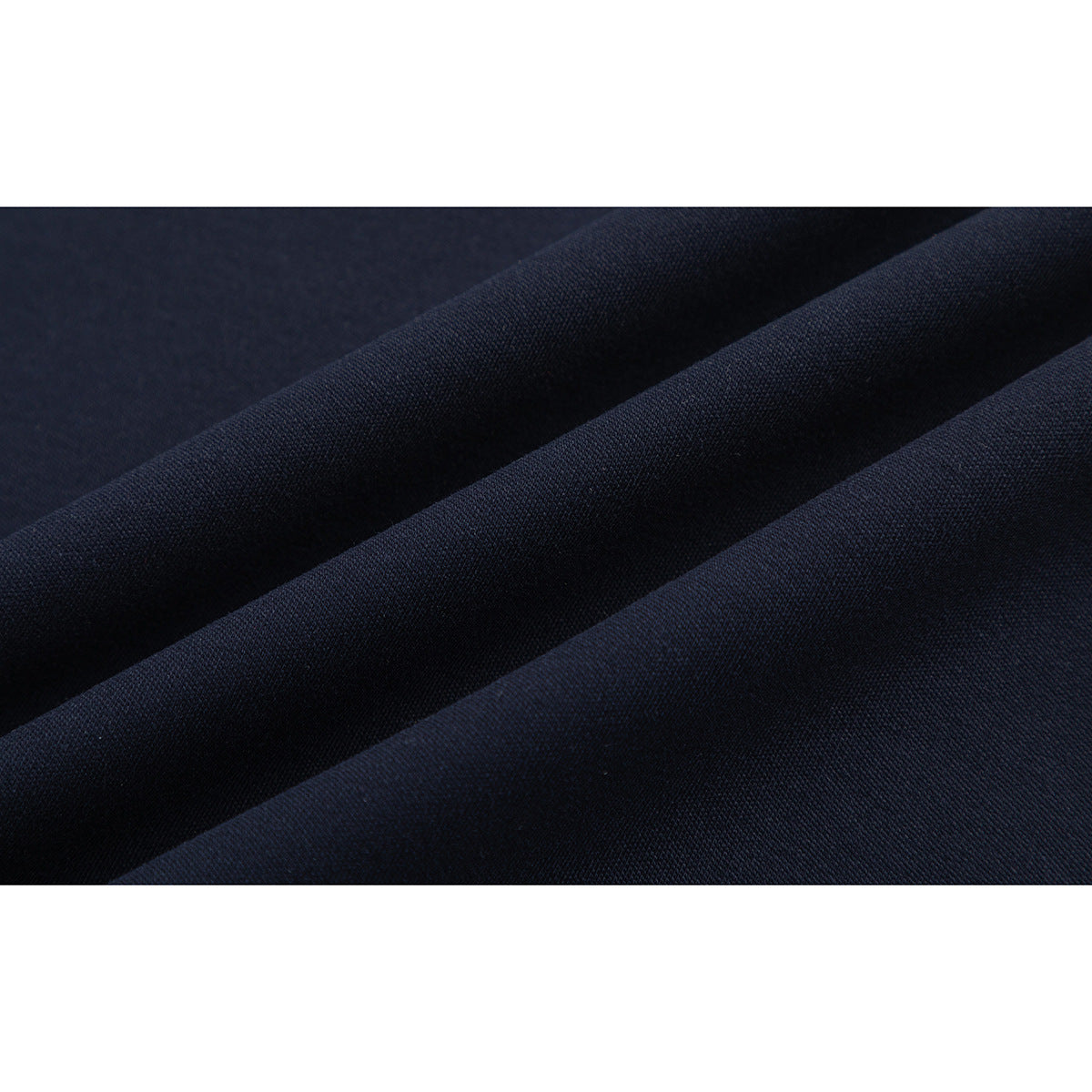 Close-up of dark navy fabric arranged in folds, showing its surface texture.