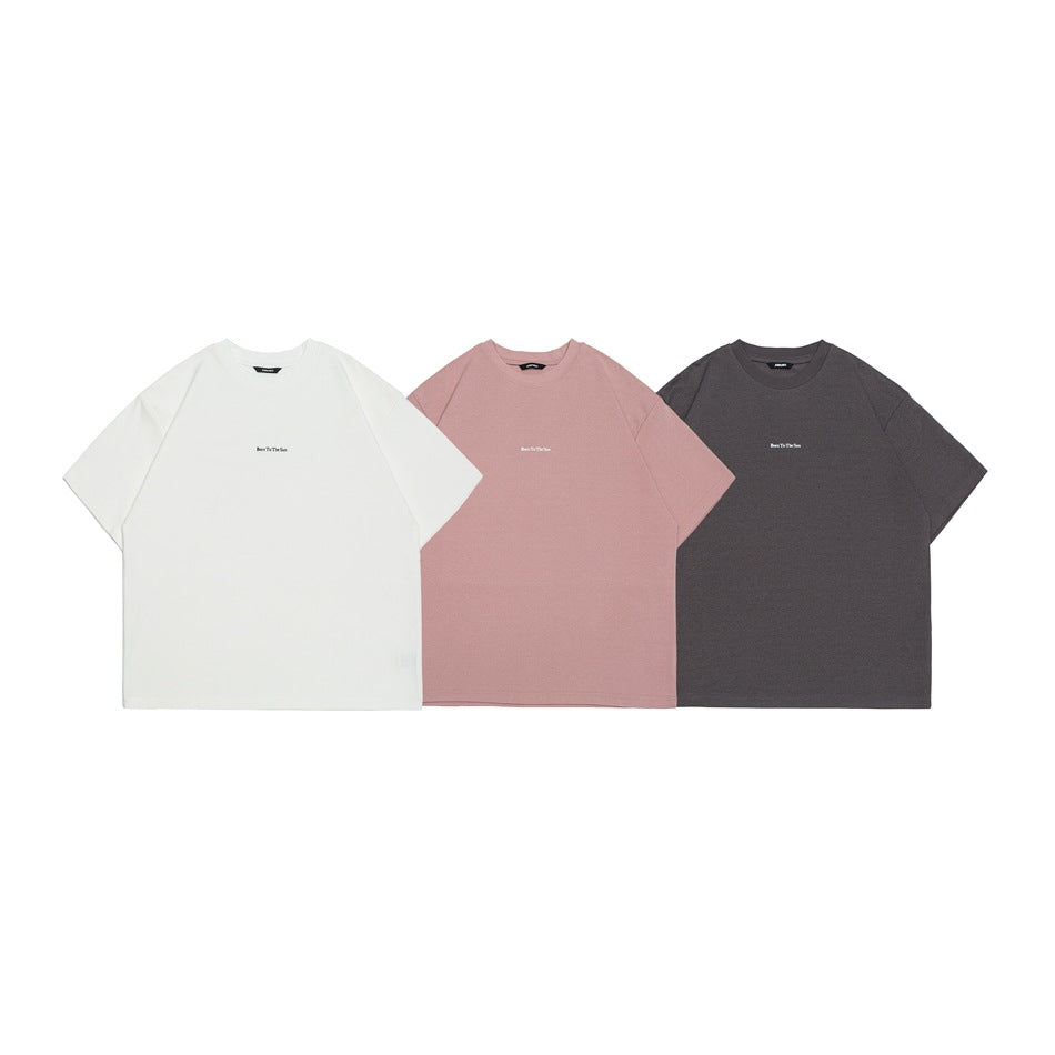 Three short-sleeve crew-neck T-shirts shown from the front in white, dusty pink, and charcoal.