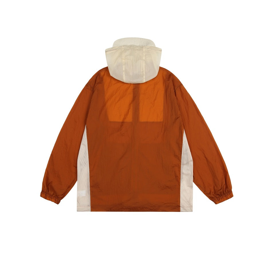 Back view of an orange hooded jacket with a cream hood and cream side panels.