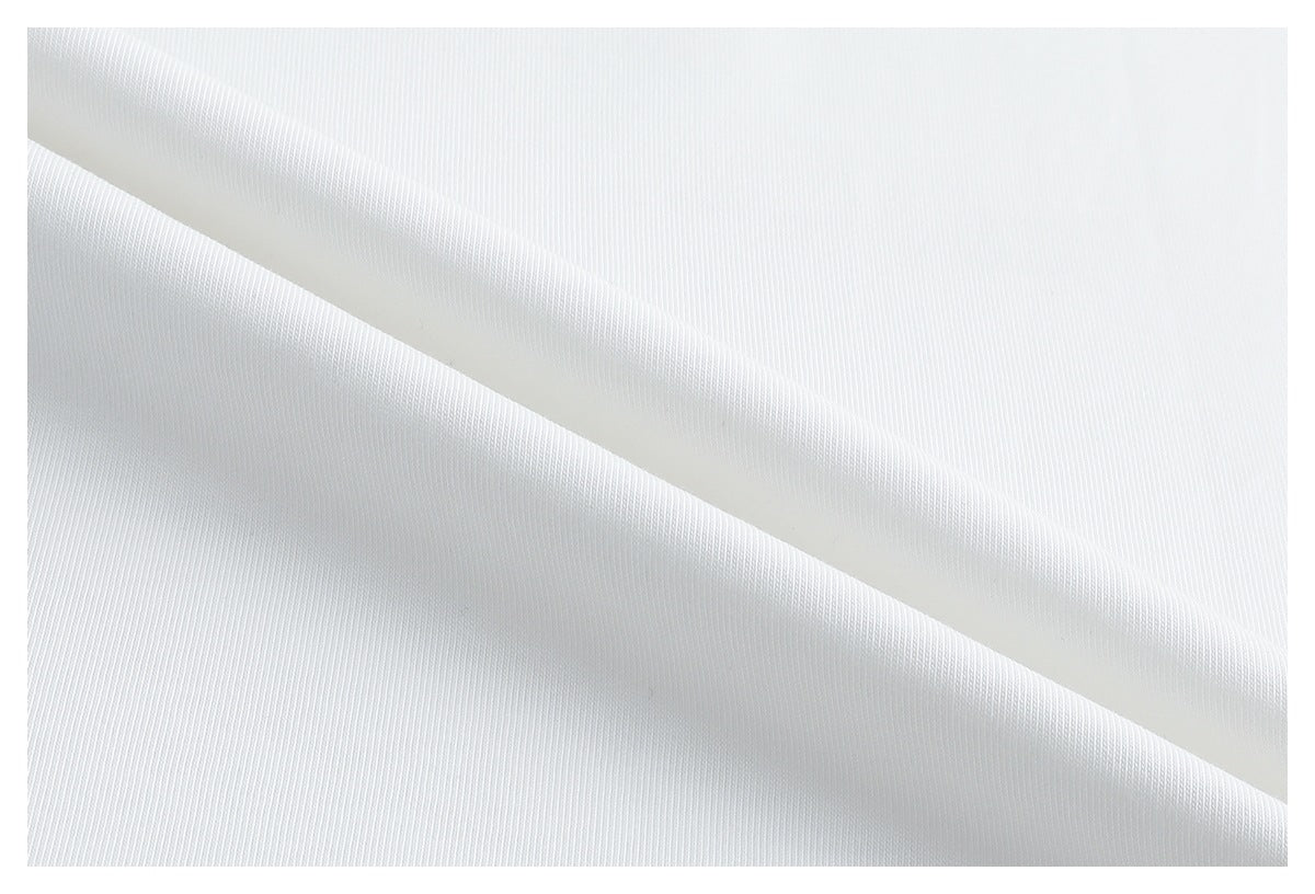 Macro view of the white T-shirt fabric, showing its fine knit texture and drape.