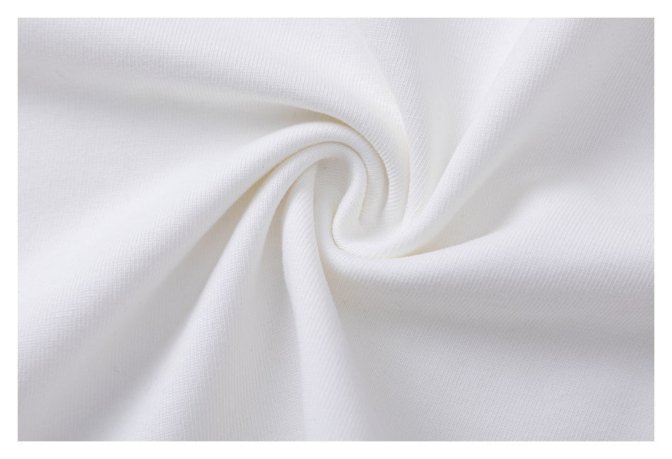 Close-up of white knit fabric gathered into a soft spiral.