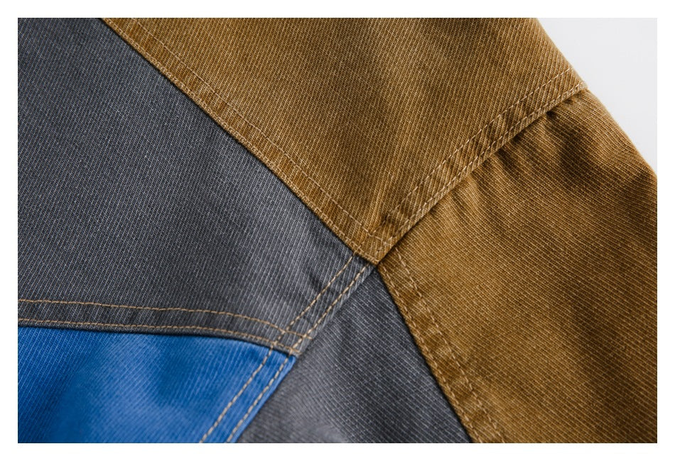 Close-up of brown, charcoal, and blue garment panels with contrasting stitched seams.
