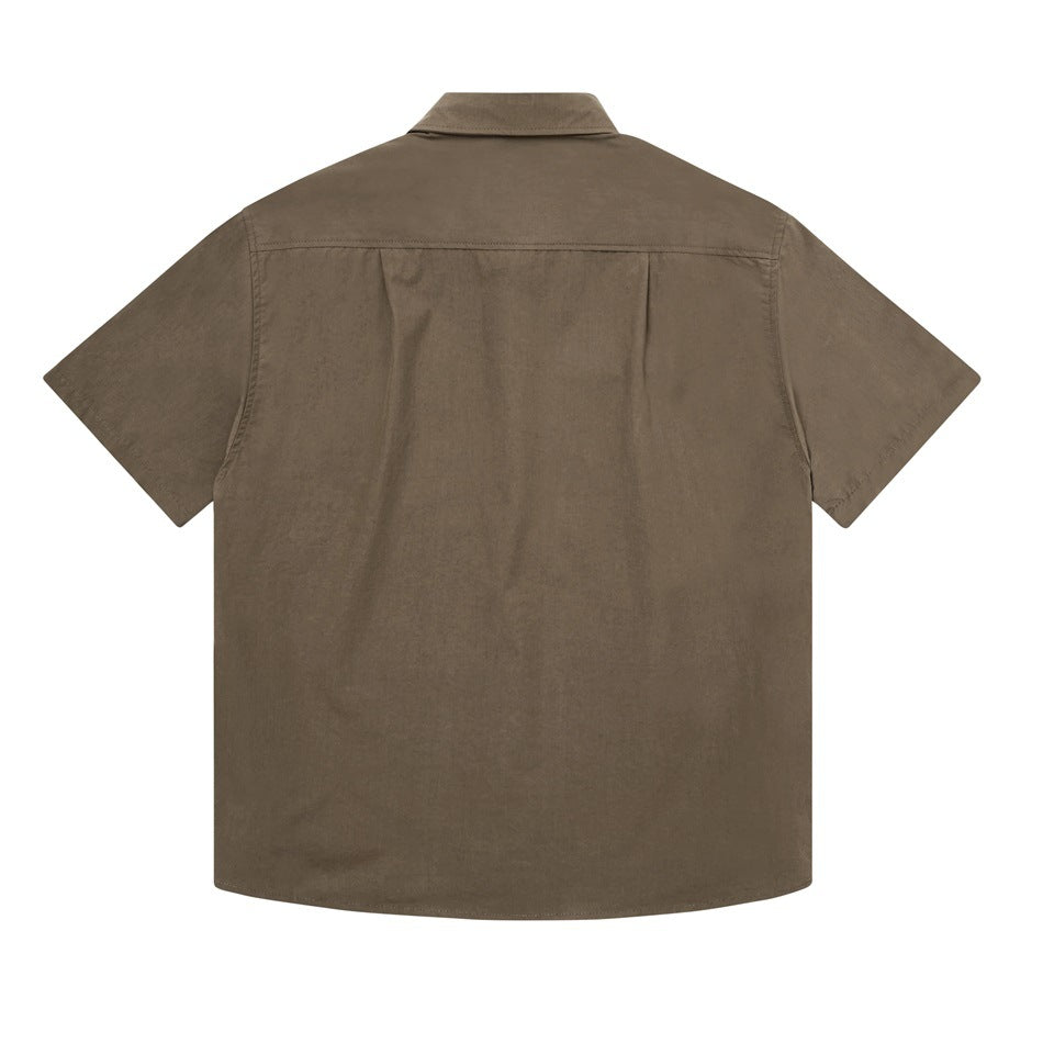 Back view of brown short-sleeve shirt with back yoke and center pleat