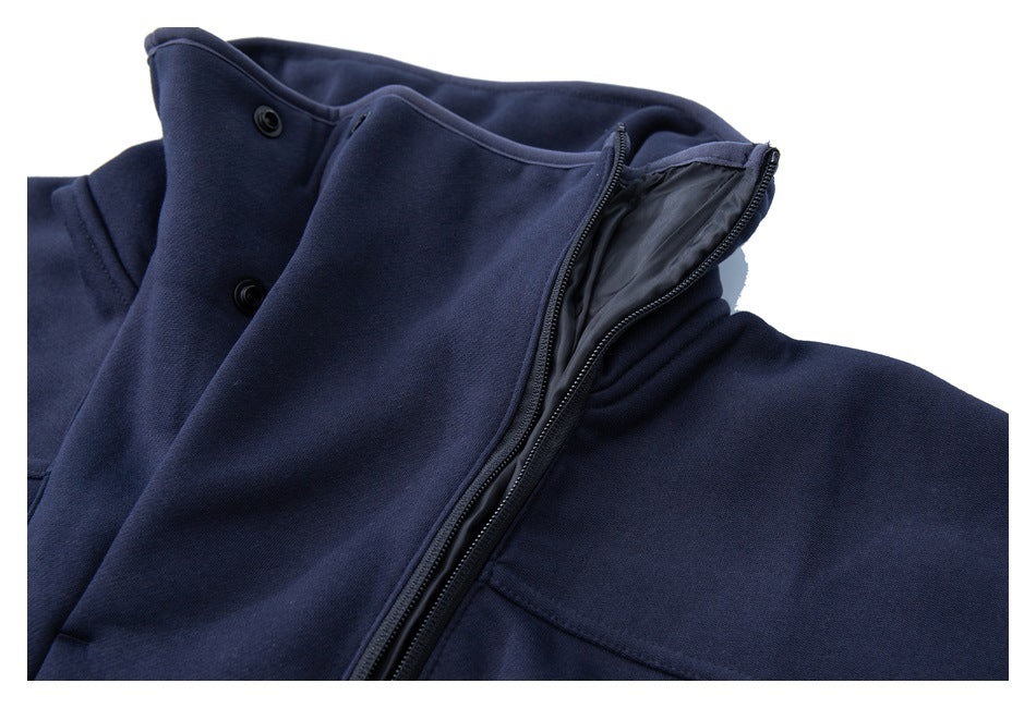 Close-up of the navy pullover's collar opened to show the inner lining and snap buttons.