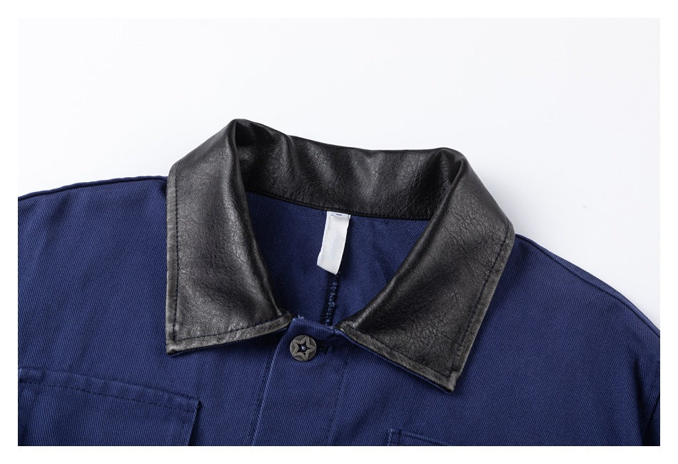 Close-up of the jacket's black collar, blue fabric, and top button.