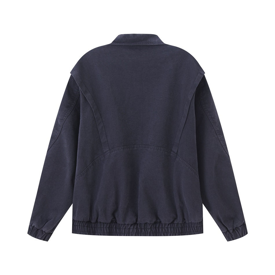 Back view of a dark navy jacket with curved seam panels, long sleeves, and an elasticated hem and cuffs.
