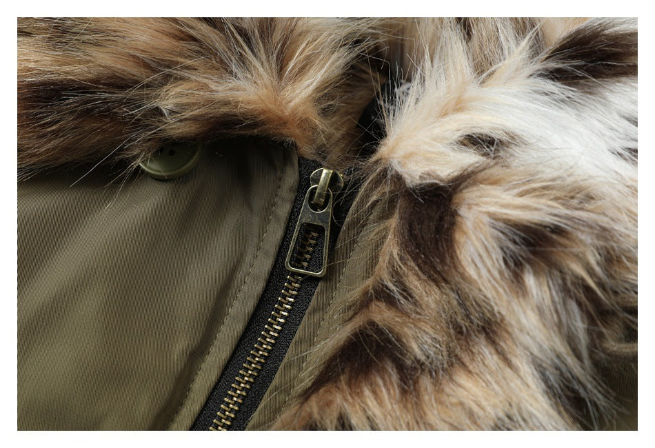 Close-up of the olive jacket’s brass-toned zipper and faux-fur collar trim.