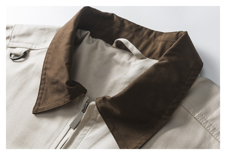 Close-up of the jacket's dark brown collar, zipper, and inner hanging loop.