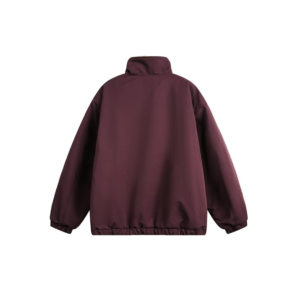 Back view of a solid burgundy jacket with a high collar, long sleeves, and elasticated cuffs and hem.