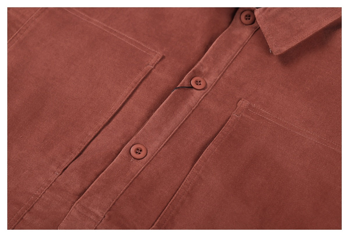 Close-up of the rust-brown shirt's button placket, buttons, and chest pockets.