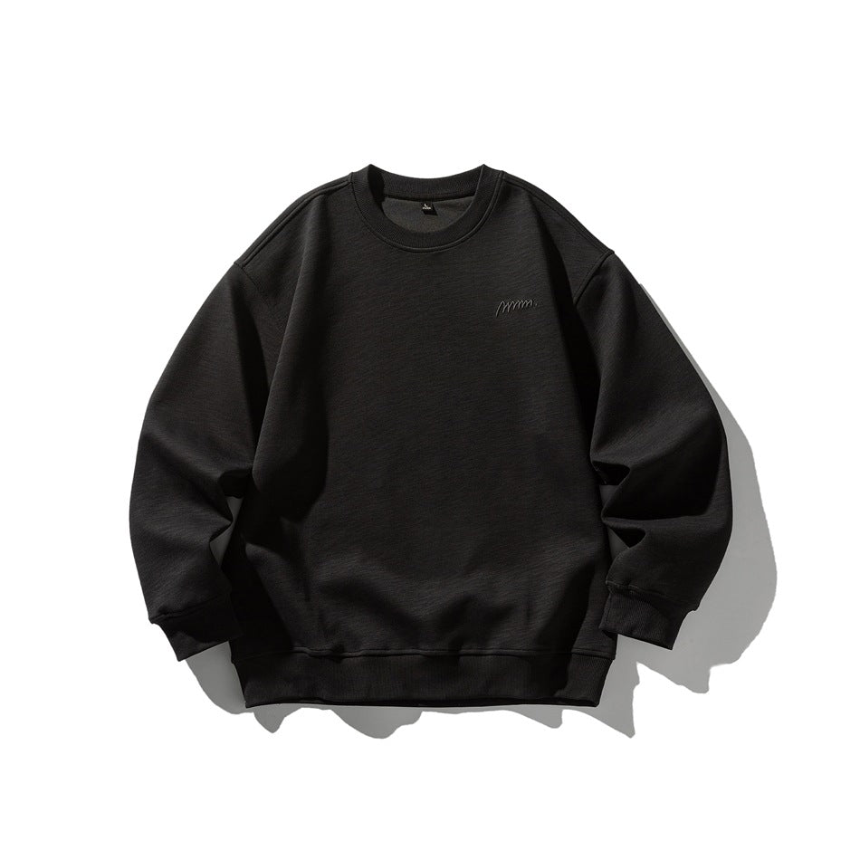 Black crew neck sweatshirt flat lay, front view, with ribbed trim and small tonal chest embroidery